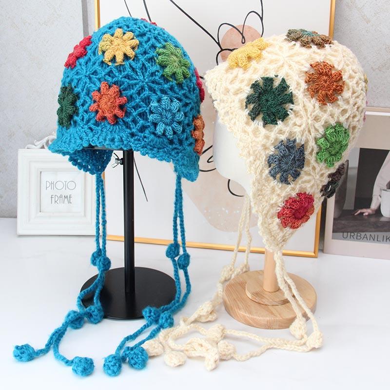 Handmade crocheted ear protection hat women's autumn and winter ethnic style colored flower knitted hat fringed strap ball bag head wool hat