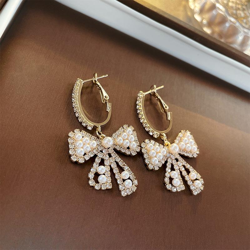 

Элегантные серьги-бантики из искусственного жемчуга и стразов - Легкая роскошь для женщин