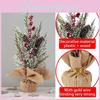 Delightful Faux Snowy Christmas Tree Centerpiece With Decorative Pinecones And Red Berries Ideal For Festive Table Arrangements