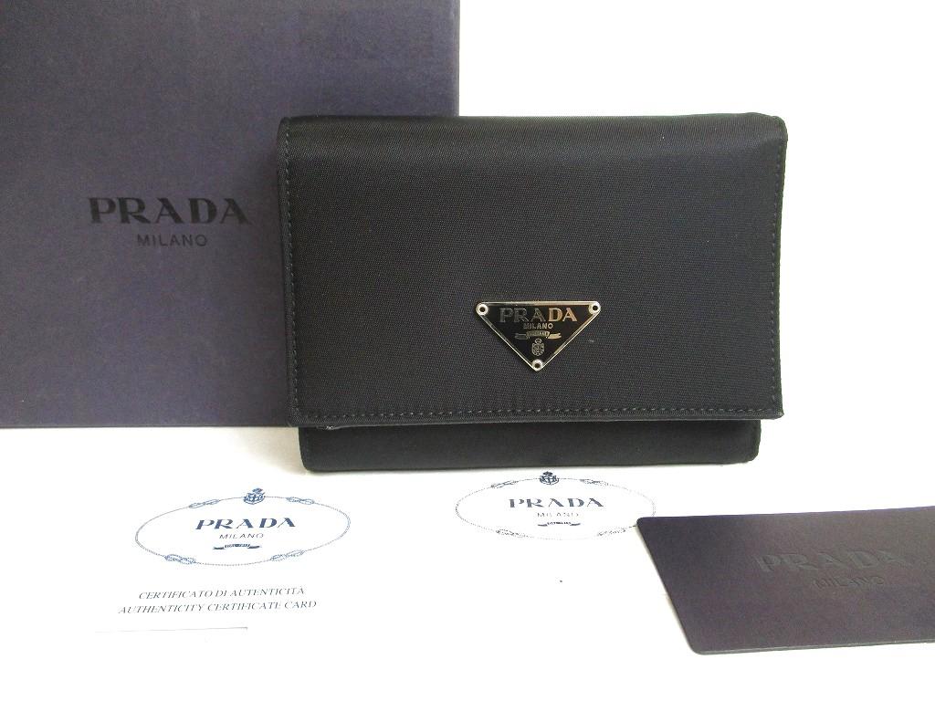 

Автентична портмоне-гаманець PRADA з чорного нейлону та шкіри №a578 відремонтована