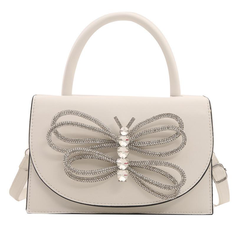 

Трендовая уличная сумка кроссбоди из искусственной кожи с деталью в виде банта со стразами белый