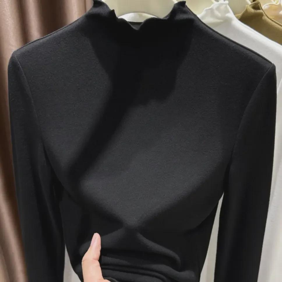 

Женская блузка из утолщенного немецкого бархата с длинными рукавами, воротником-полувысокой и деревянной отделкой ушек, коллекция осень/зима 2024 года. XXL (65-75 kg) чёрный