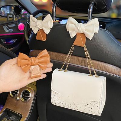 Crochets de voiture en forme de nœud mignon pour dossier de siège de voiture, crochet robuste pour sac à main, accessoires de voiture peu encombrants