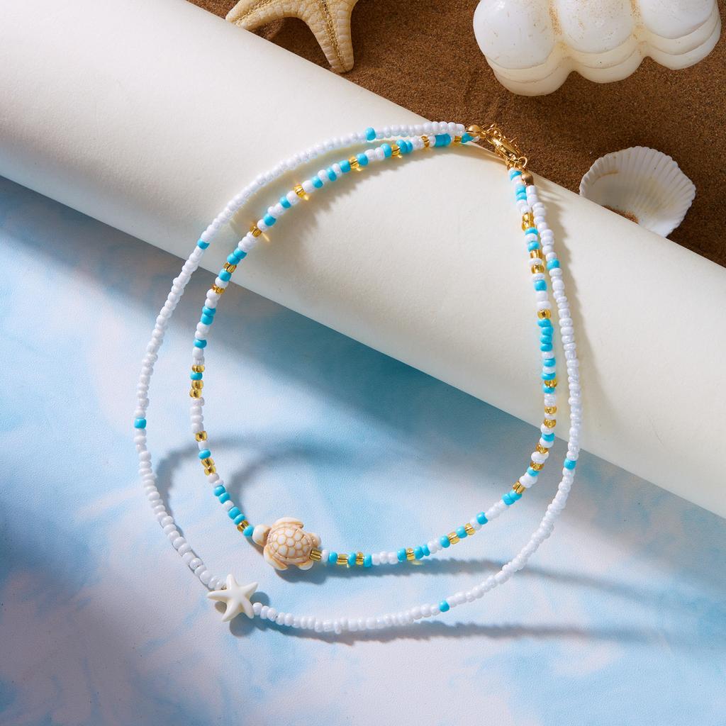 Perlenketten-Set für Damen 2 Stück Samenperlen-Choker mit Meeresschildkröte Seestern Anhängern Layering Sommer Boge Strand Schmuck