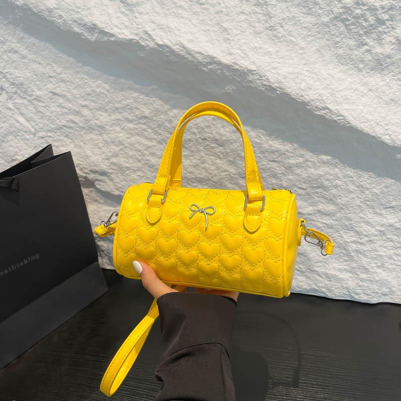 New summer popular casual and beautiful fresh solid color bow cylinder bag portable shoulder messenger bag women's bag