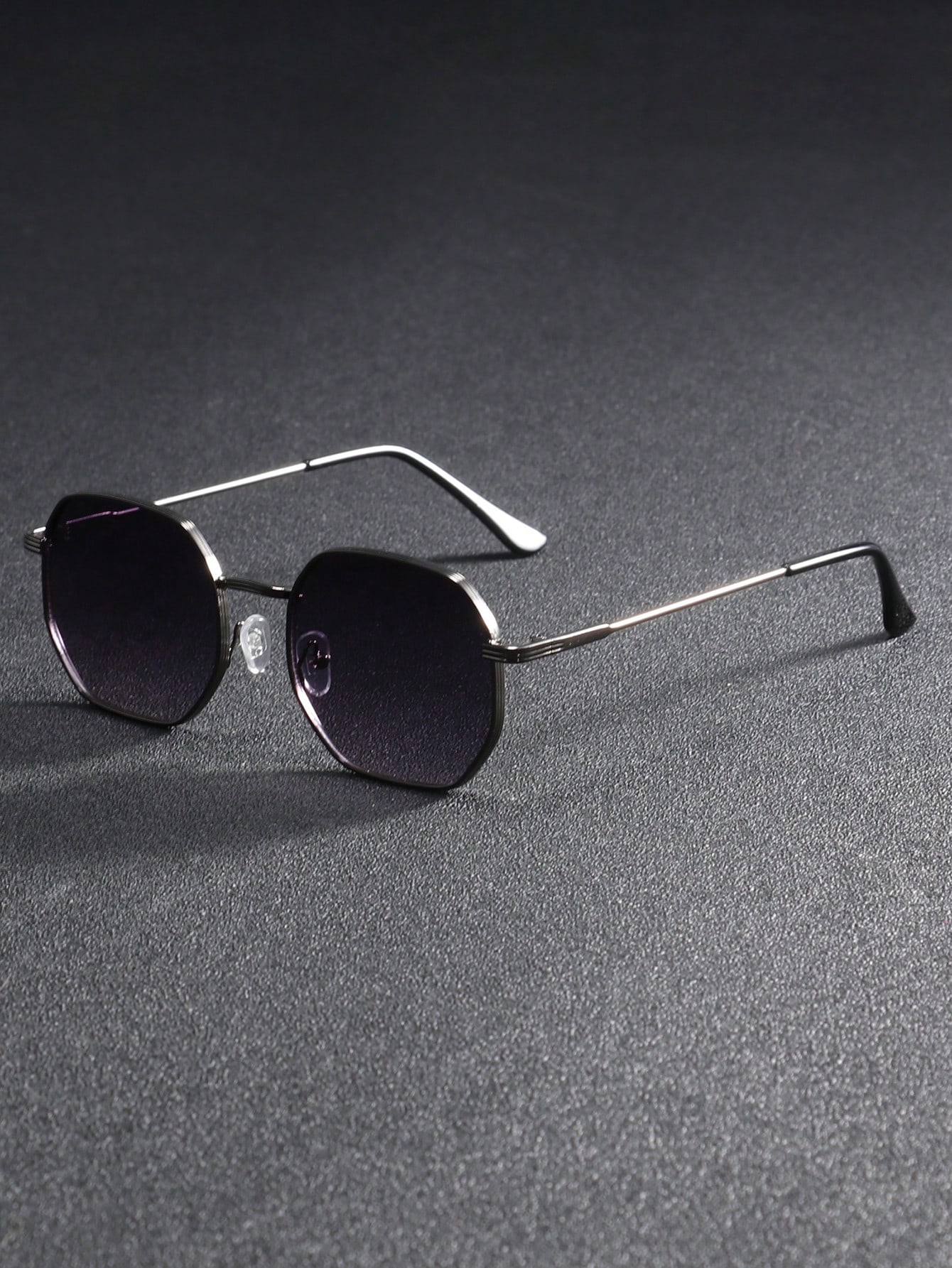 A pair of men s metal frame sunglasses with geometric edges серый