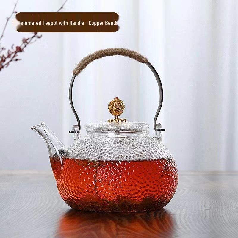 Hammerstruktur-Borosilikatglas-Teekanne mit Kupfergriff für Induktionsherde