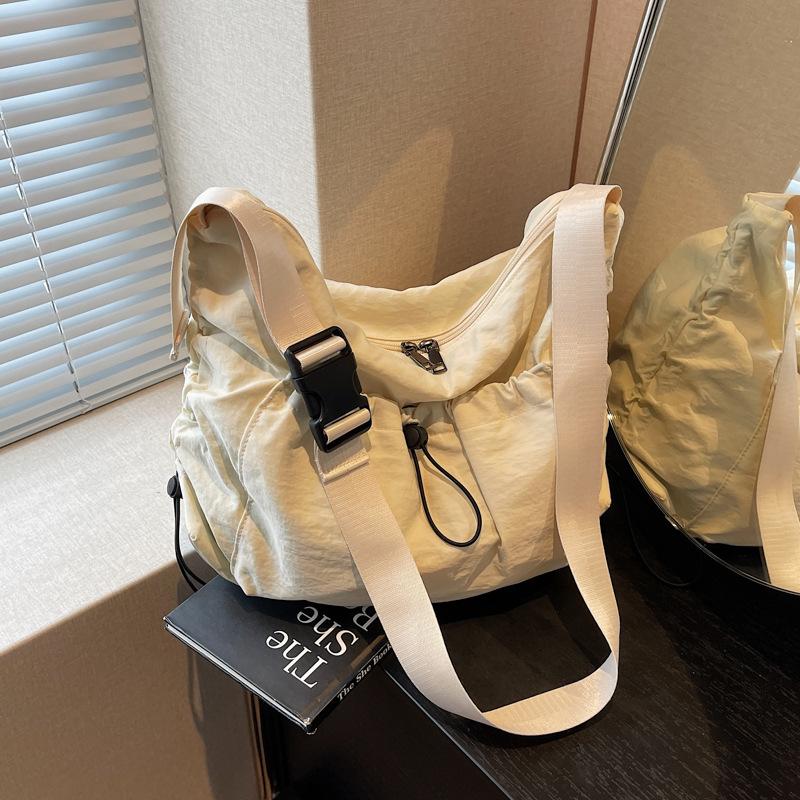 Large Capacity Messenger Bag Canvas Bag Women's New Versatile Niche Single Shoulder High Sense Commuter Dumpling Bag