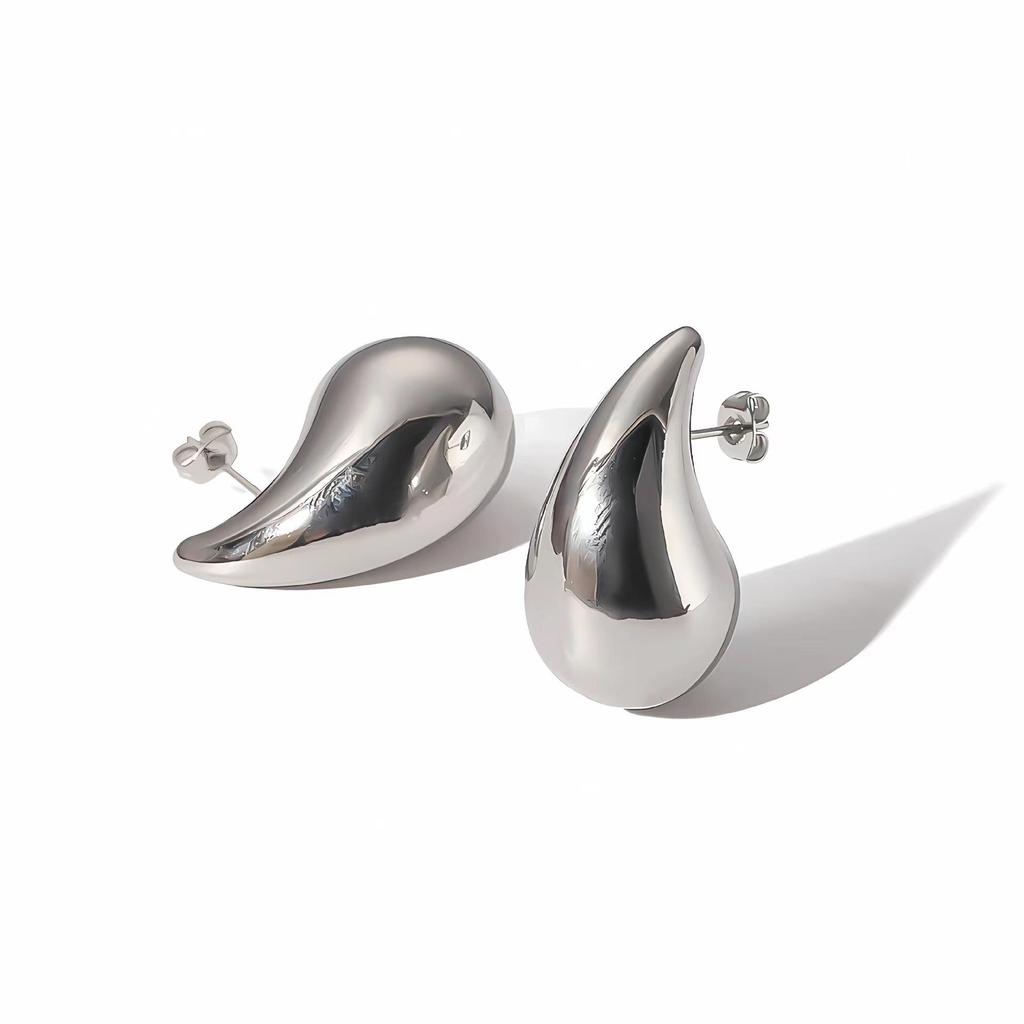 Stylish Women’s Jewelry Set: Stainless Steel Hollow Teardrop Necklace, Gold Stud Earrings, Titanium Steel Bracelets, and Rings.