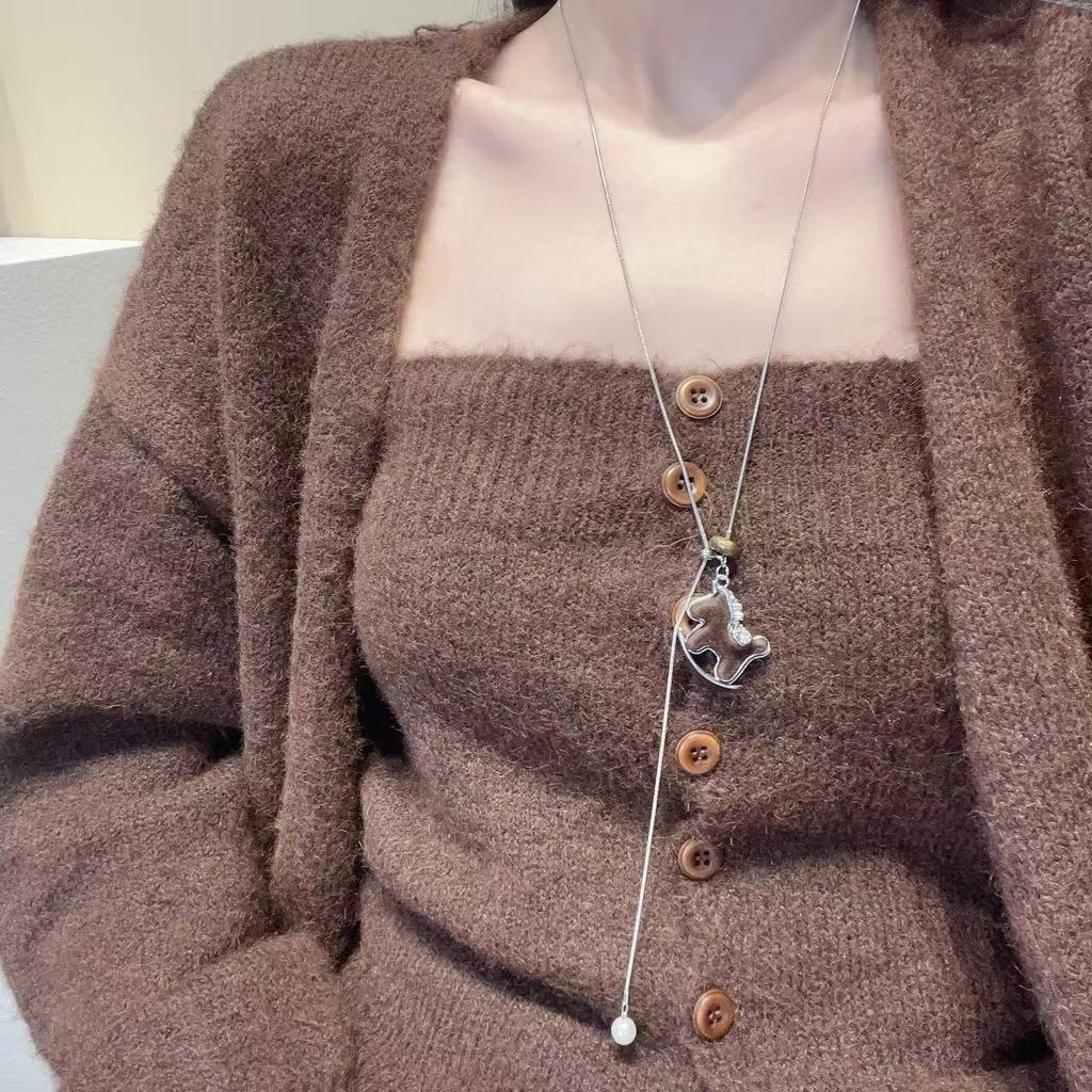 Flash zirconium coffee color Trojan horse pendant can pull necklace women's niche design long high-end wooden pony sweater chain