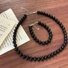 Retro Schwarzes Achat Perlen Halsketten- und Armband-Set mit Pulloverketten-Design.