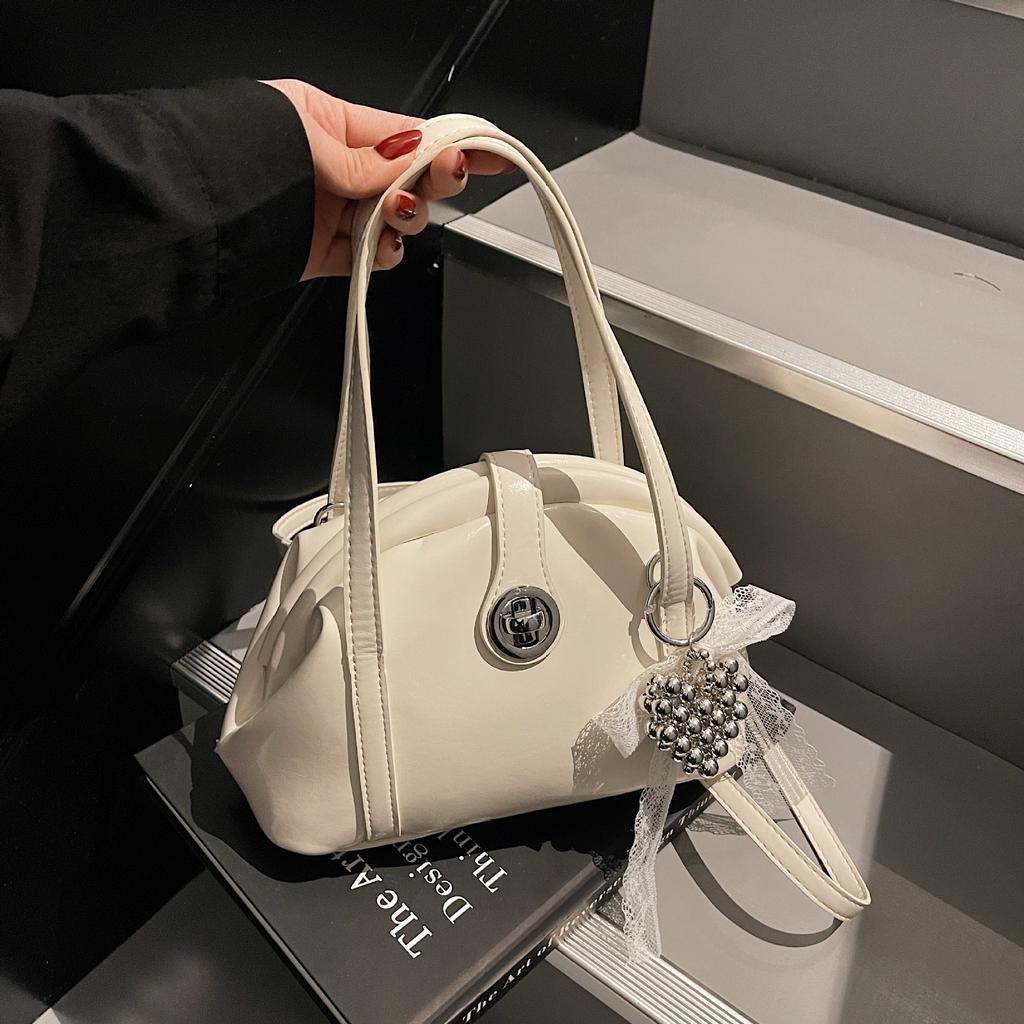 Spring and Summer Portable Dumpling Bag Women's 2025 New Niche Design High-end Fashion Versatile Messenger Saddle Bag