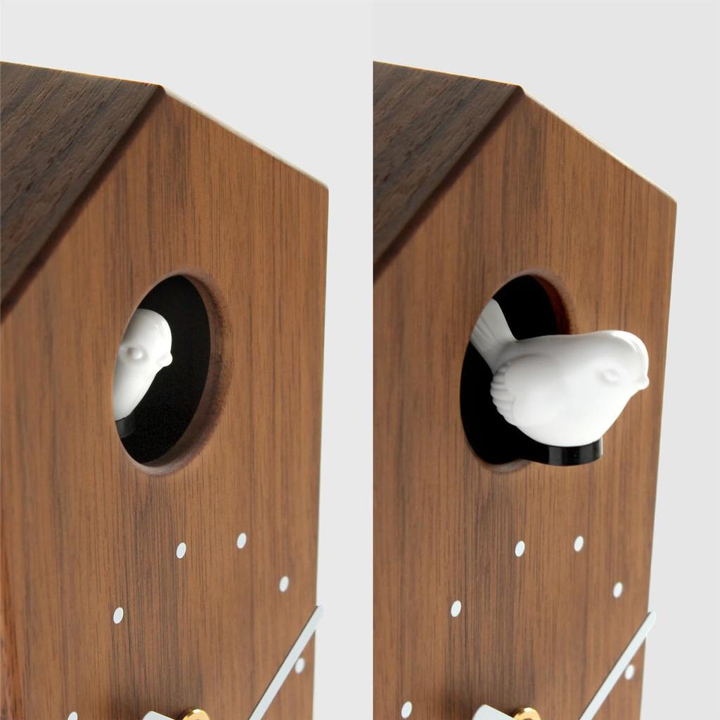 Soothing cuckoo chirps that arrive with the A wooden cuckoo clock that can be placed on a table or mounted on a "Cuckoo Clock" - time. (walnut) wall.