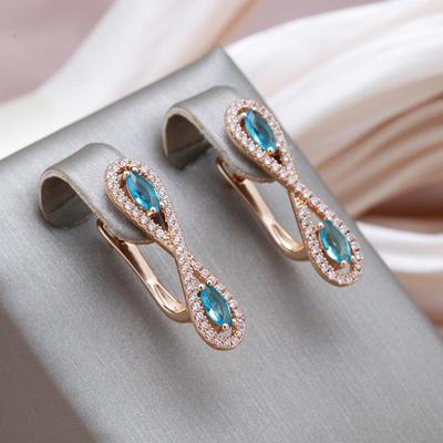Pendientes Simétricos de Circonita Azul Kinel Color Oro Rosa