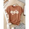 Women's European and American style summer short-sleeve top with contrasting colors and a print of several white daisy flowers, fashionable