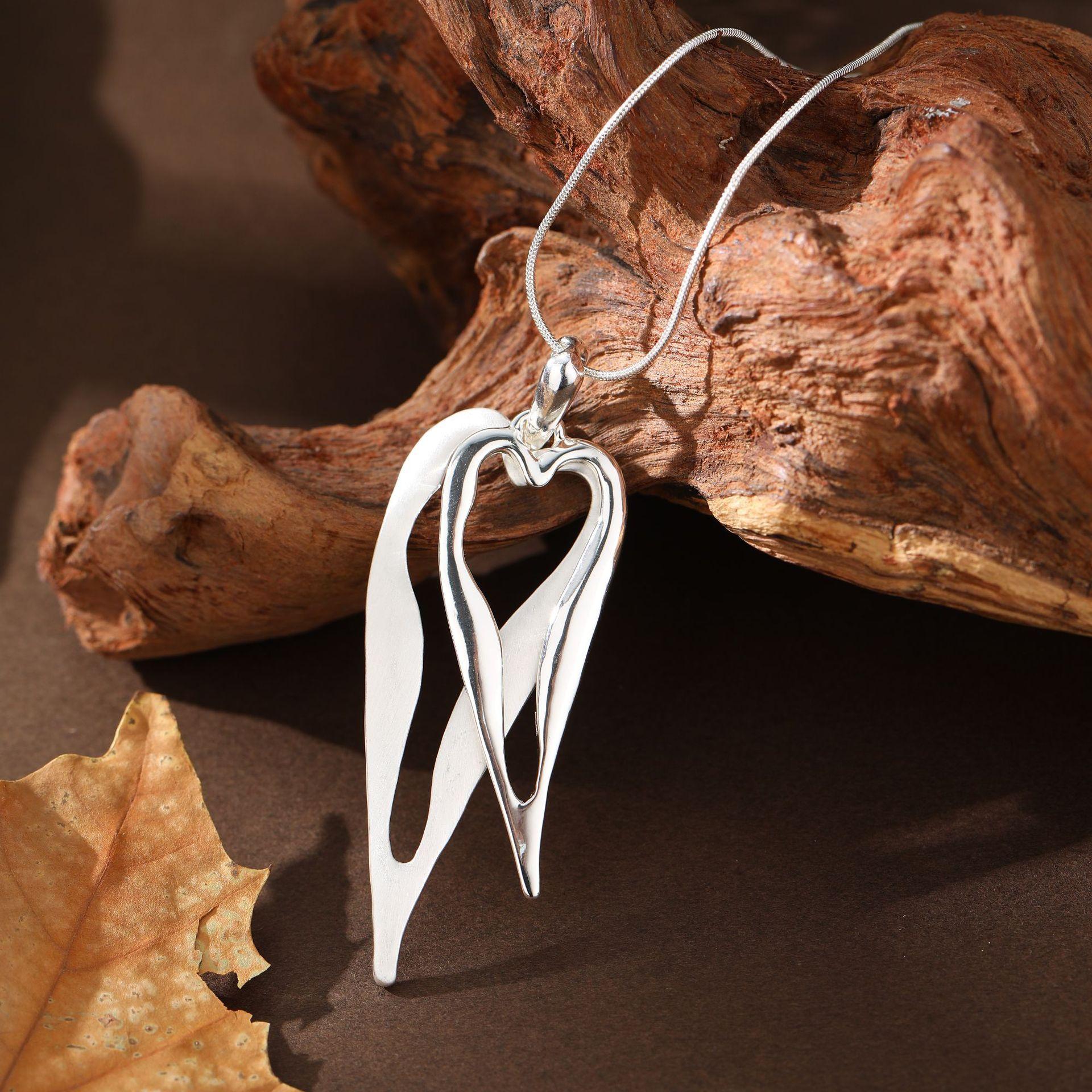 

New brushed hollow heart long necklace, women s high-end double-layer hollow heart long pendant