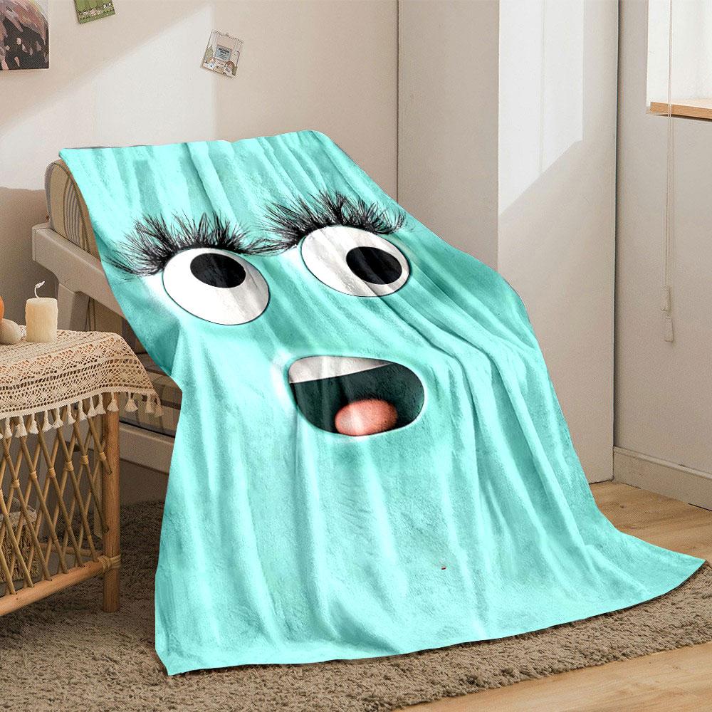 A playful turquoise face with large eyes, long lashes, and an open mouth. for all seasons blanket lunch break throw gift