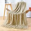 Orange knitted throw blanket for model homes, suitable for use as a sofa or bed throw, for furniture stores and home showrooms as a soft decoration