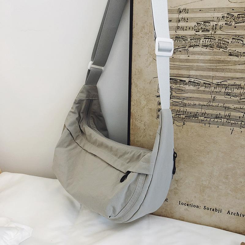 Casual crossbody bag girls lightweight shoulder canvas bag waterproof commuting solid color versatile nylon dumpling bag for men