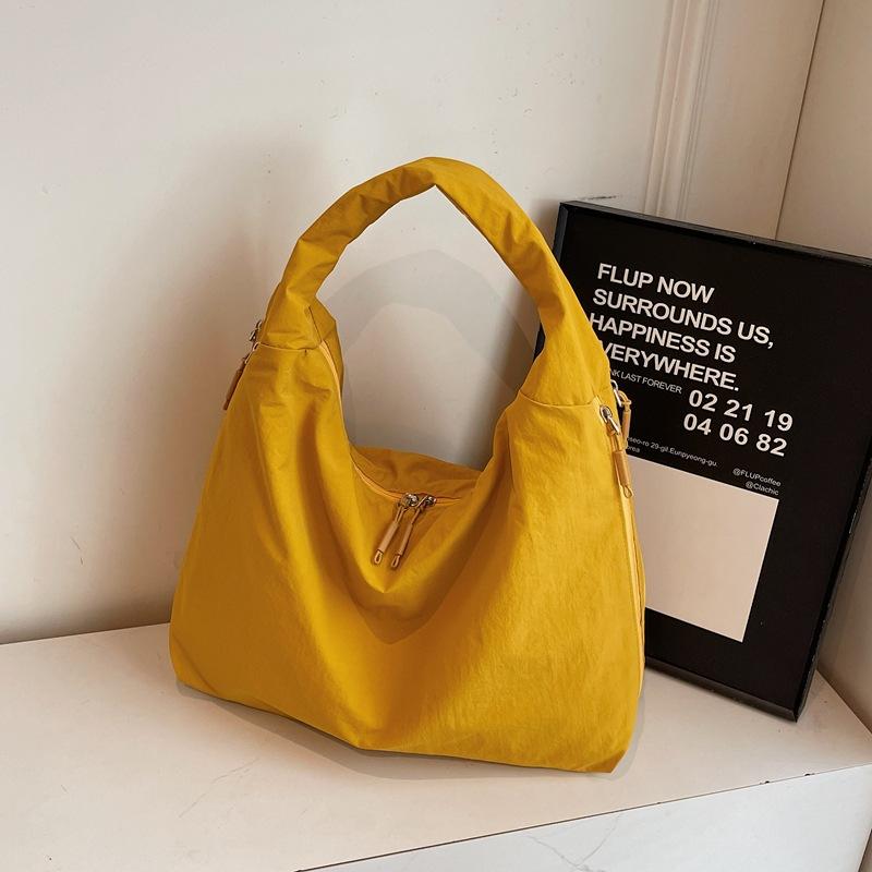 

Large-capacity tote bag women s 2025 new simple solid color shoulder bag Korean lazy style commuter handbag жёлтый