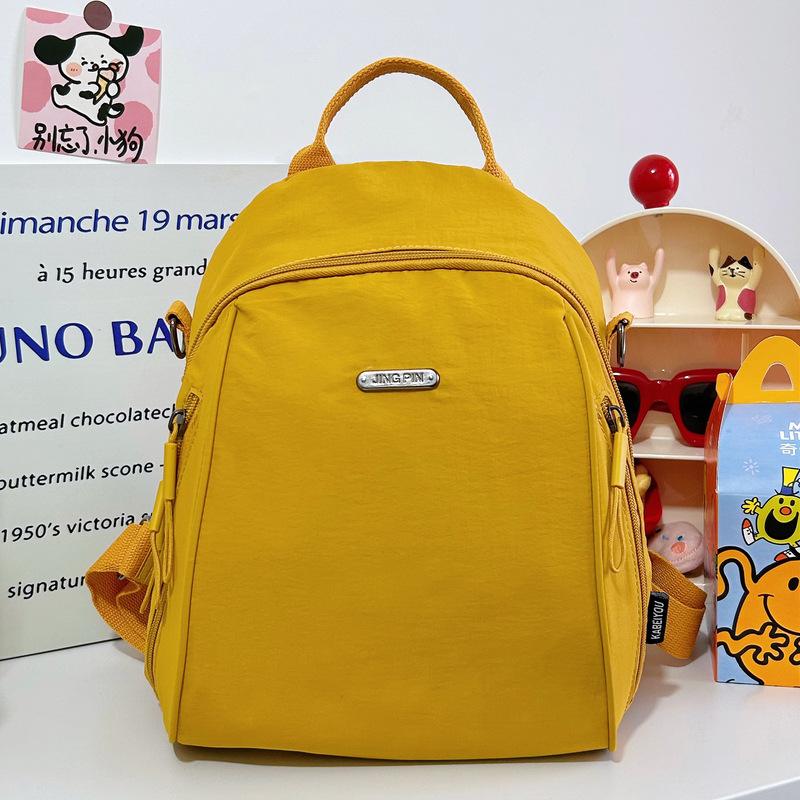 Versatile solid color women's backpack large-capacity leisure bag simple backpack light schoolbag light luxury student bag commuter bag