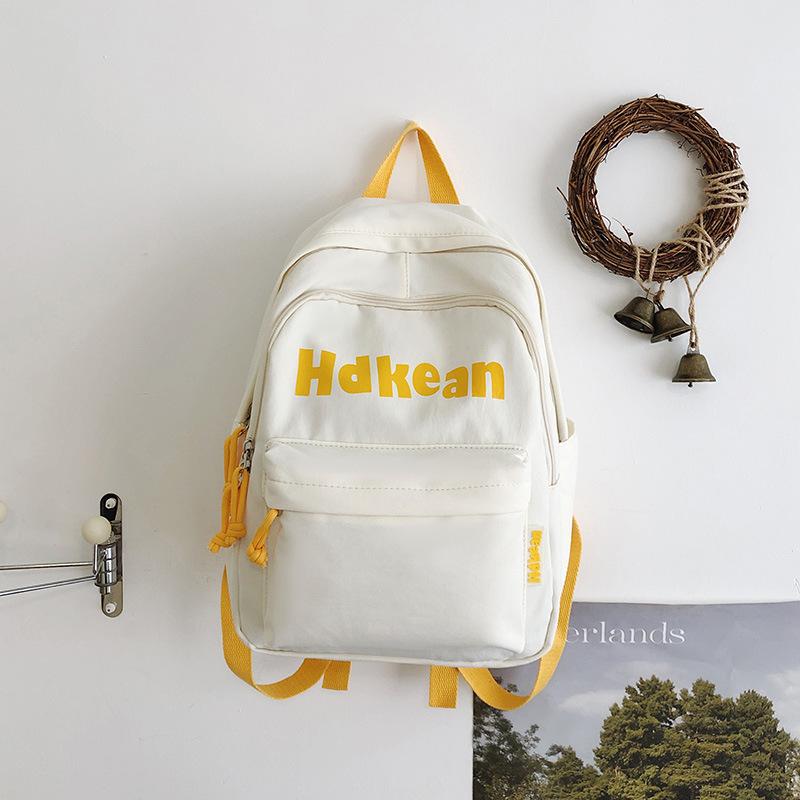 New High-value Solid Color Simple Letter Backpack Couple Casual Lightweight Large-capacity Backpack