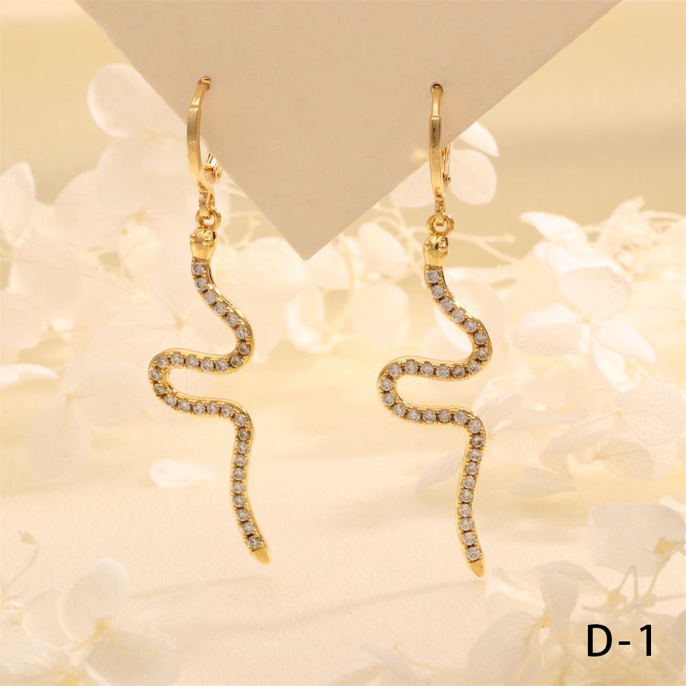 

Exotic Emerald & Zircon Snake Ear Cuffs: Bold, Fashionable Statement Earrings