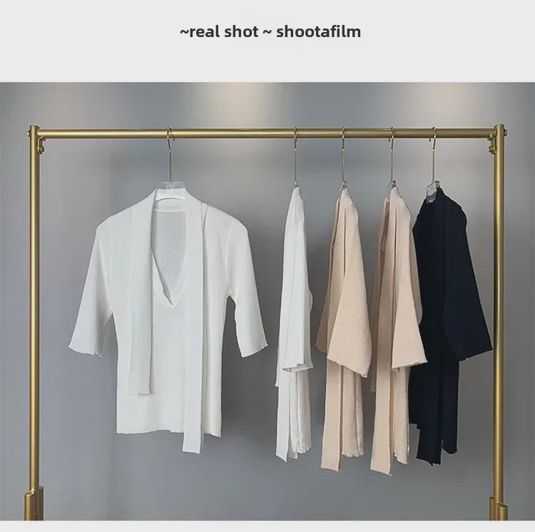 Koreanischer Dongdaemun Slim Fit Strickpullover mit halblangen Ärmeln und Schleifendesign für Damen