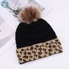 European and American fashion leopard print hairball decoration niche versatile knitted hat autumn and winter travel windproof warm wool hat