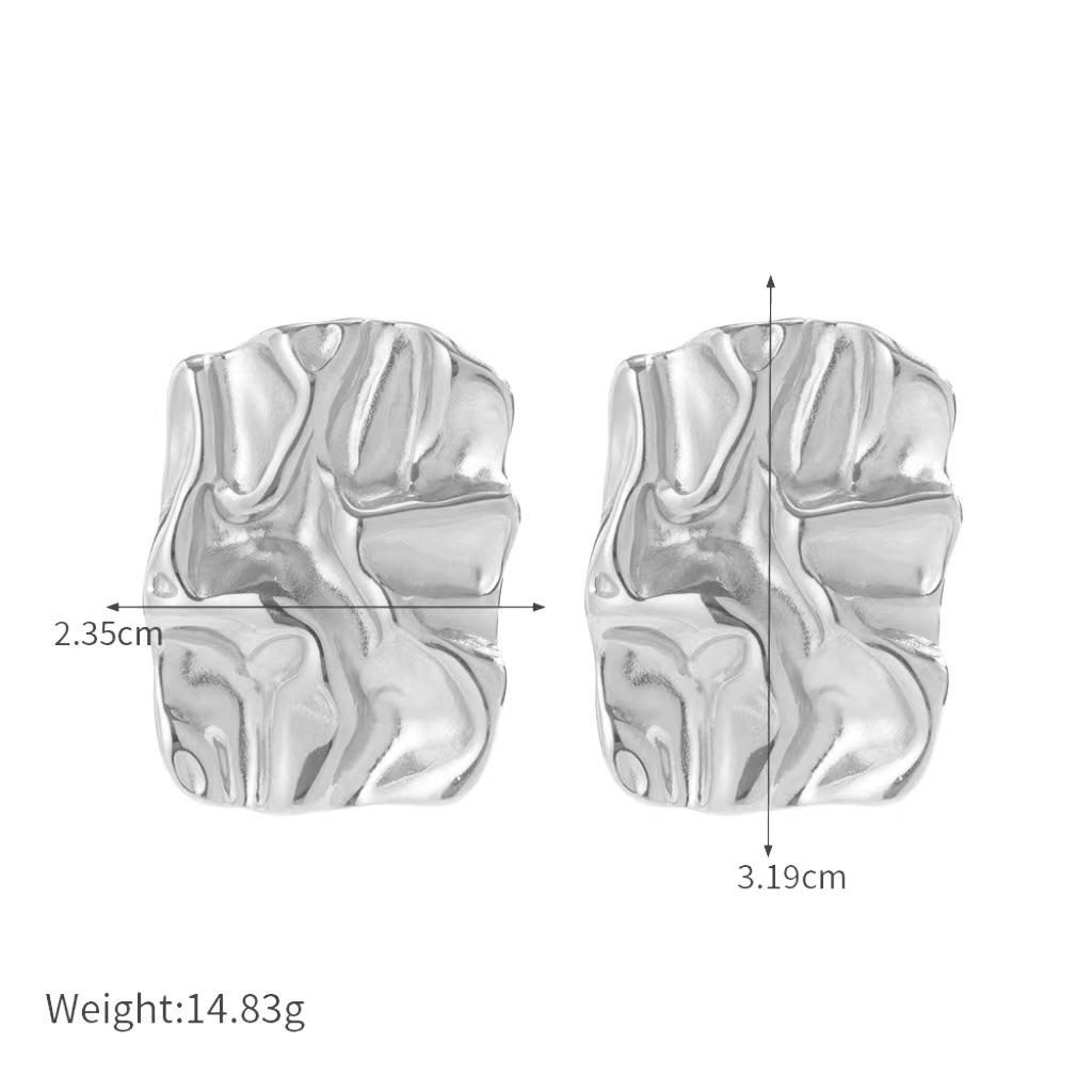 

Золотистые шикарные серьги из 18-каратного золота и серебристой титановой стали с современной кованой текстурой серебряный