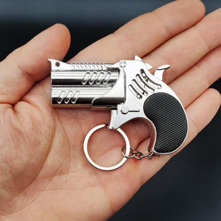 1Pcs Mini Keychain Metal Rubber Band Gun Game Toy Gun Launcher საბავშვო სიმულაციური პისტოლეტი სათამაშოები საჩუქრები საკიდი