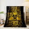 Biohazard Warning Sign on Yellow Brick Wall Flannel blanket for bedroom, living room, sofa, and nap sofas