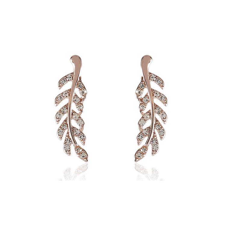 European Fashion Silver Needle Leaf Stud Earrings with Symmetrical Hollow Design and Modern Elegance