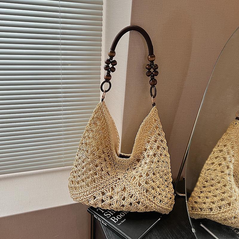 Large capacity hollow bag women's summer new versatile shoulder messenger bag woven seaside beach bag