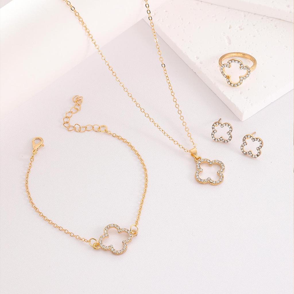 Hot-Selling Jewelry Set: Fashionable Four-Leaf Clover Hollow Diamond Necklace, Bracelet, Earrings, and Ring