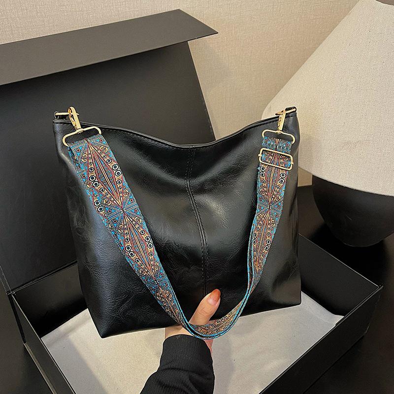 2025 Retro Shoulder Bags: Women's Large Capacity Wide-Band Messenger Bags - Spring/Summer Advanced Texture Bucket Design.