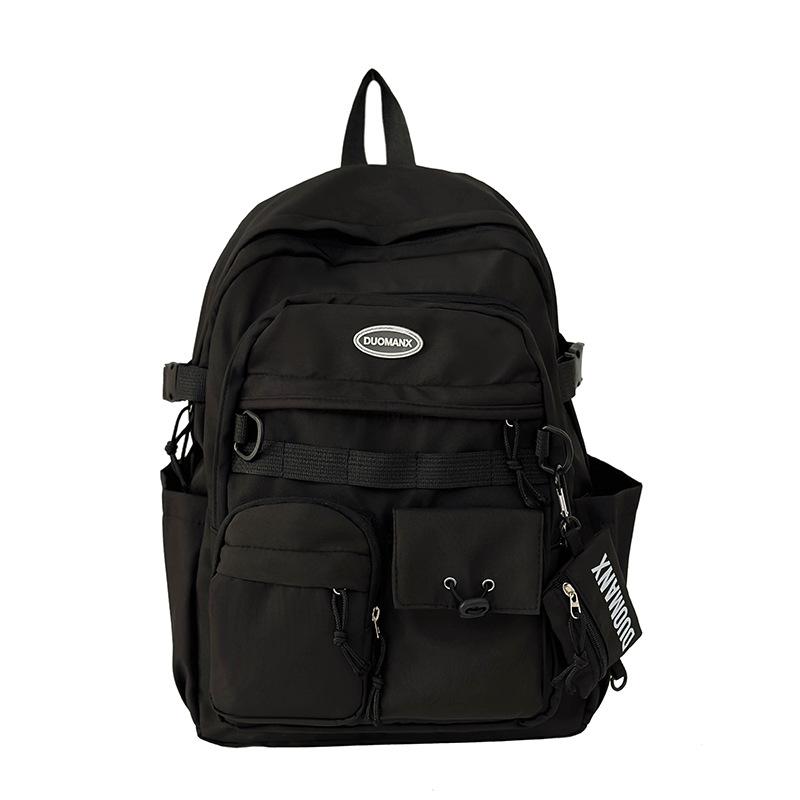 Simple solid color casual backpack high value junior high school student schoolbag large capacity versatile tooling backpack