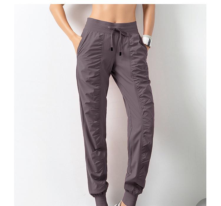 2021 Spring Women's Breathable Loose Fit Nine-Point Running Pants with Pockets