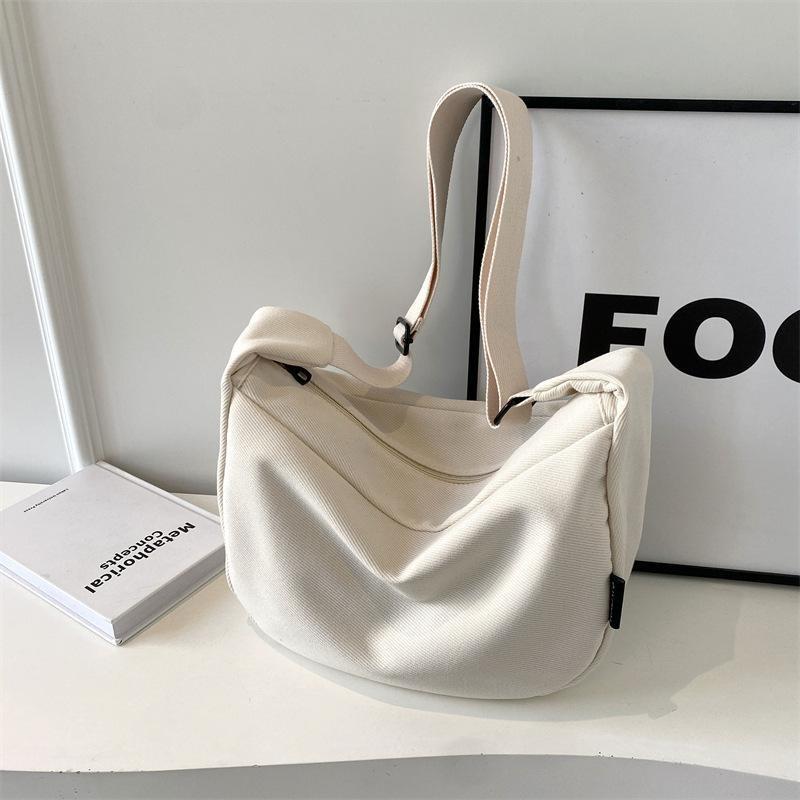 

Canvas bag corduroy new wide shoulder strap messenger bag large capacity commuter dumpling bag single shoulder ins wind