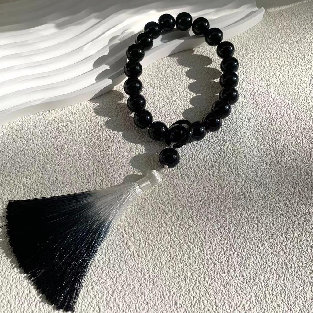 Obsidian Gradient Tassel Jade-Style Phone Charm with Antique Lion Dance Design