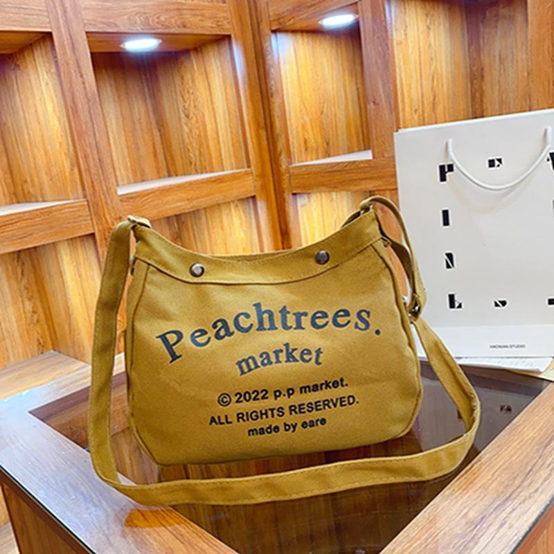 Canvas bag Large capacity women, canvas bag, retro trendy popular casual letter shoulder bag Student tutoring bag
