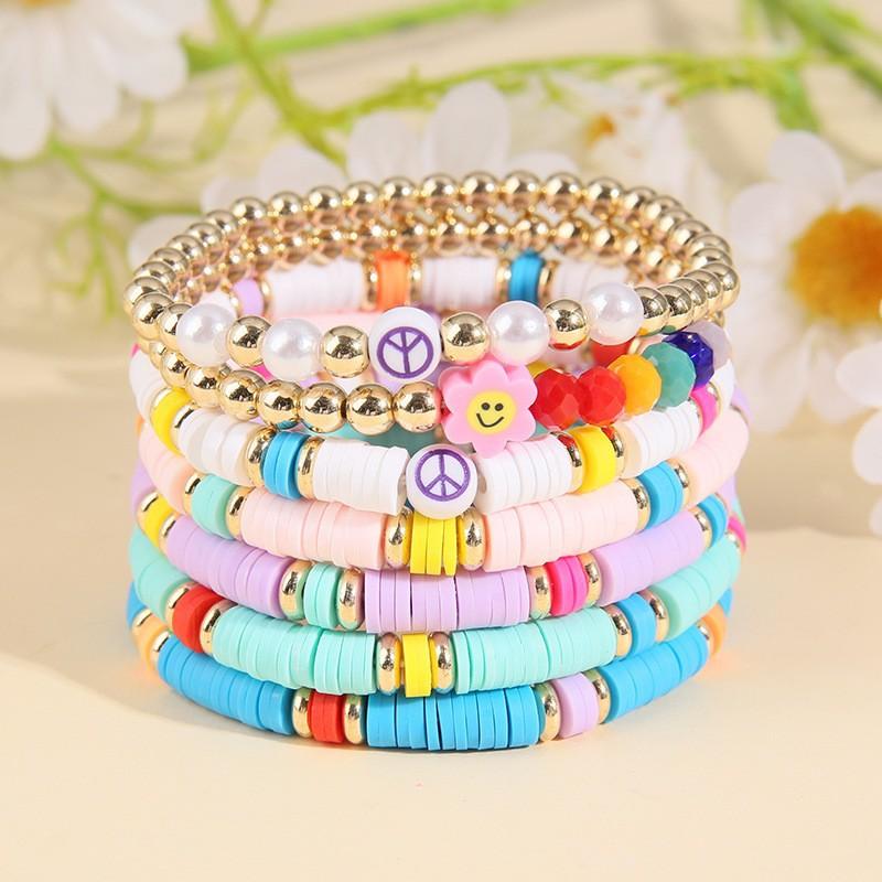 Korean version of fashion new multi-layer elastic thread soft pottery love smiley face bracelet set retro handmade pearl jewelry women