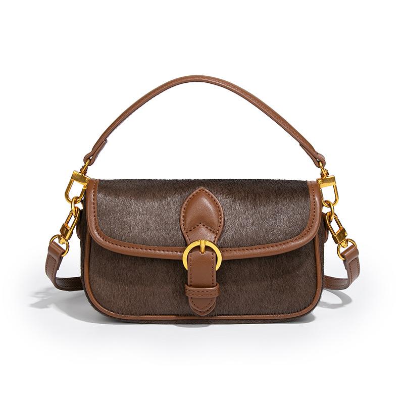 

Осень и зима 2025 ретро темперамент легкая роскошь сумка из конского волоса кожаная вставка сумка-седло на одно плечо кроссбоди для通勤 мобильная сумка