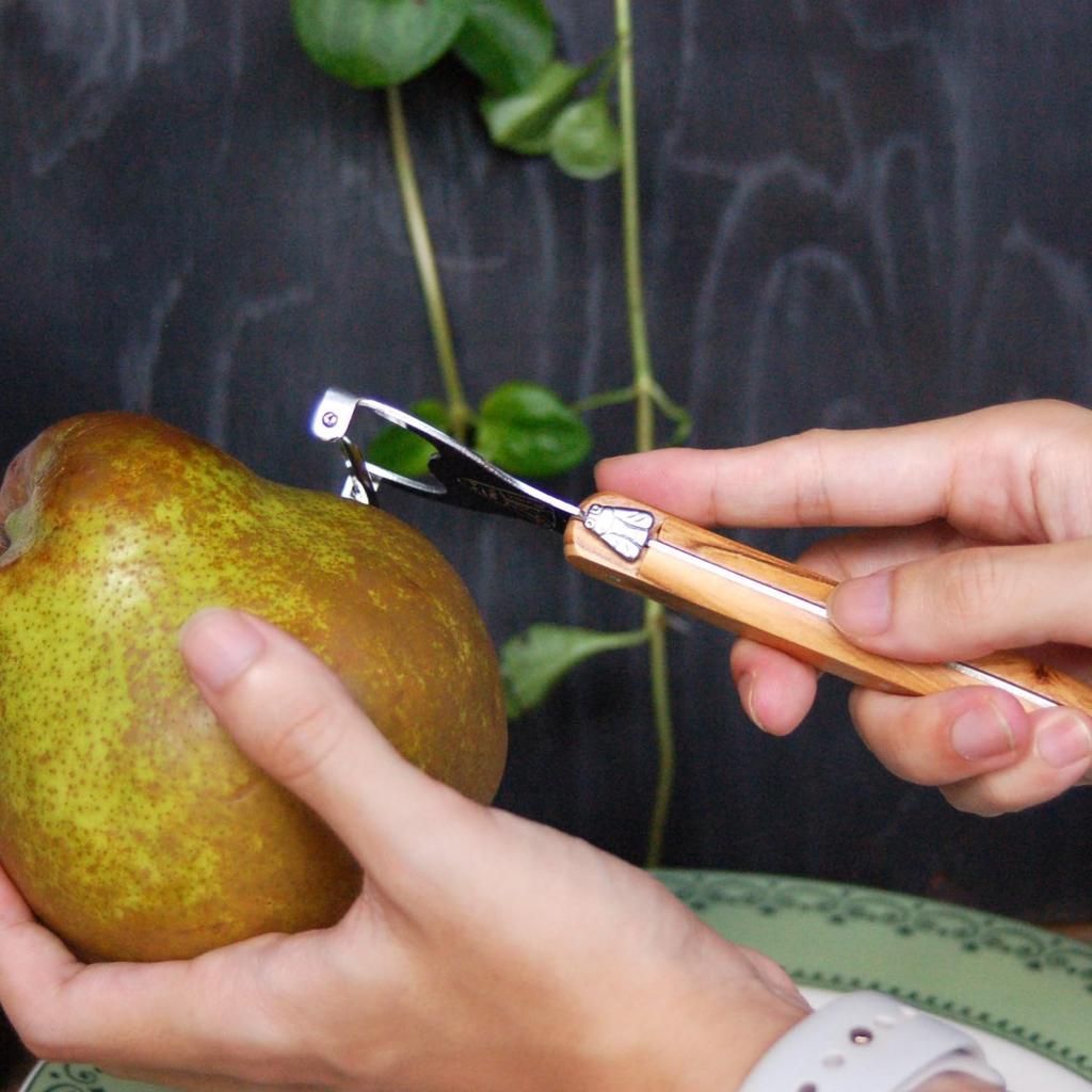 The NERON Peeler Features a Comfortable Wooden Handle and Laguiole Olive Made In This Peeler Combines the Elegant Design and Artisanal Sharpness of a