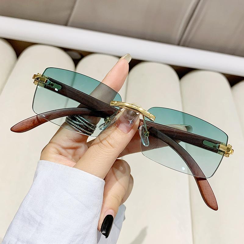 New frameless trimmed personalized sunscreen sunglasses catwalk travel fashion versatile wood grain legs advanced sunglasses
