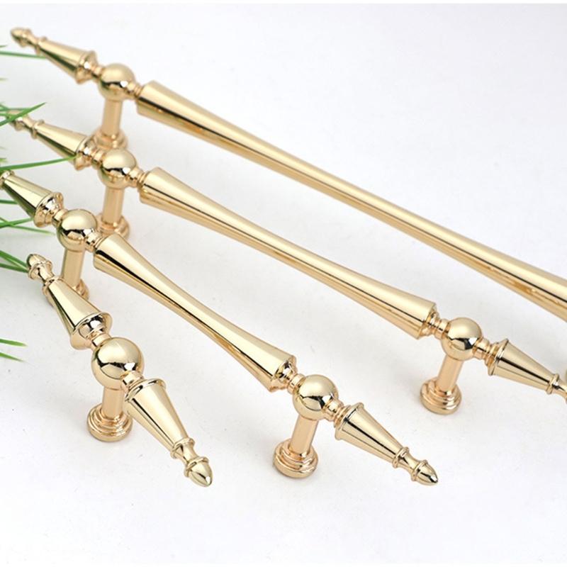 Skříňkové úchytky se zlatou povrchovou úpravou Ergonomický design Hardware odolný proti korozi Jednoduchá instalace Pro kuchyňské skříňky Komody