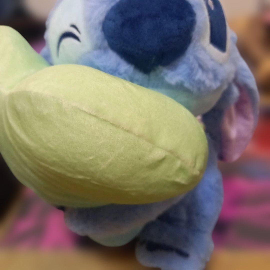 Stitch stuffed animal with heart-shaped cushion