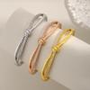 Elegant Zircon Knot Bracelet: Asymmetrical Full-diamond Design with a Fashionable Brass Base, Non-fading. Ideal for Women Seeking Unique Style.