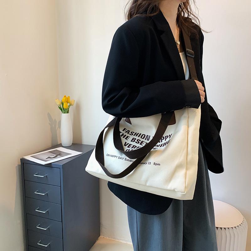Simple canvas large-capacity casual bag women's 2025 new lazy style single shoulder fashion printed letter tote bag