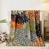 Bold, overlapping floral designs in orange, navy, green, and teal tones. for all seasons blanket lunch break throw gift